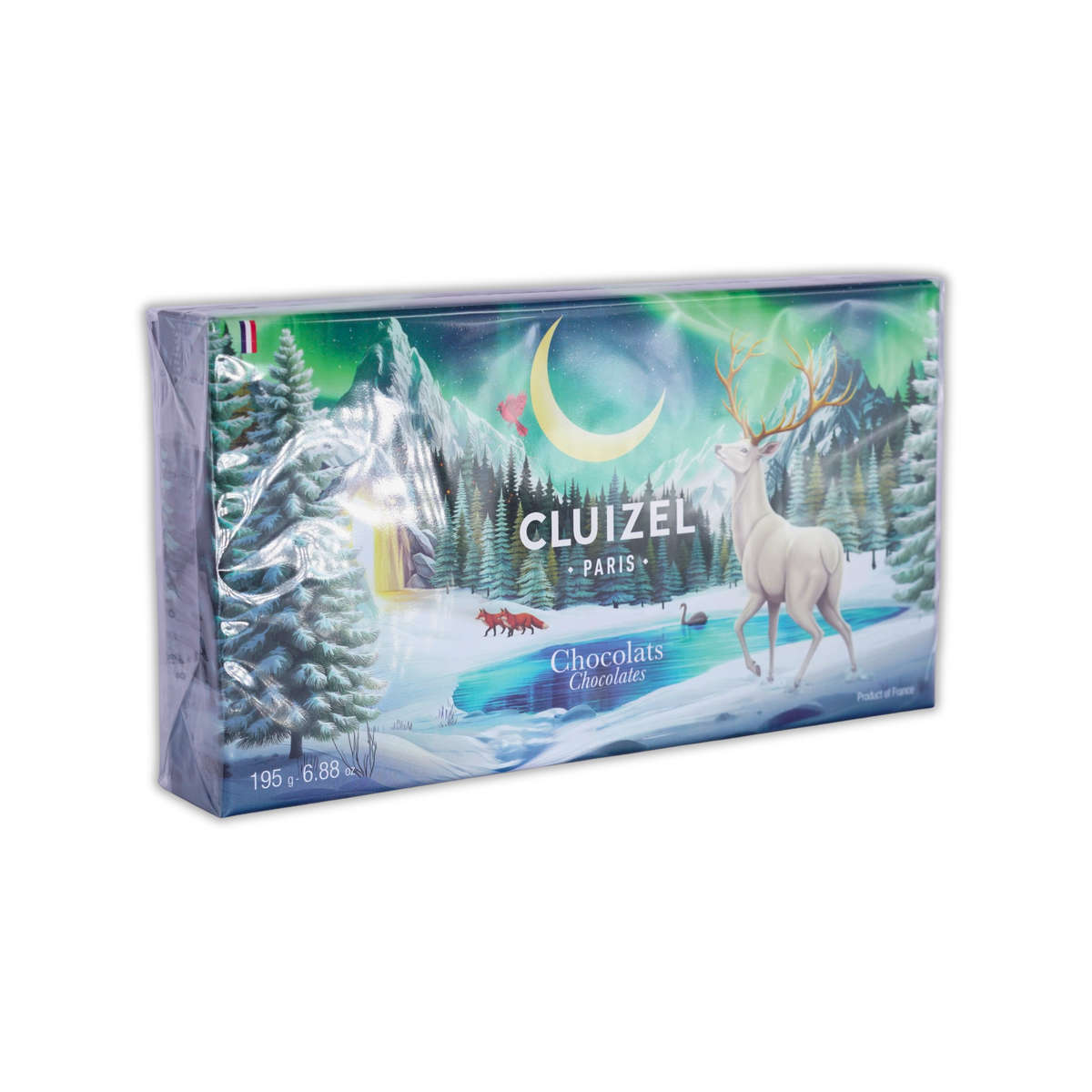 A rectangular Cluizel Paris chocolate gift box illustrated with a white stag, snowy mountains, and crescent moon.