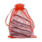 Translucent orange organza bag of Michel Cluizel foil-wrapped silver chocolate sardines