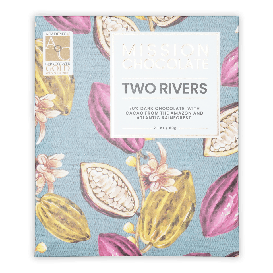Mission chocolate two rivers 70% dark chocolate bar in vibrant blue packaging with pink and yellow cacao illustrations