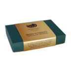 A dark green box of NearyNógs Irish Whiskey Chocolate Truffles with a gold paper sleeve against a black background.