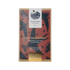 A rectangular dark chocolate bar wrapper with red background black bird and citrus designs from nearynogs ireland