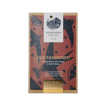 A rectangular dark chocolate bar wrapper with red background black bird and citrus designs from nearynogs ireland