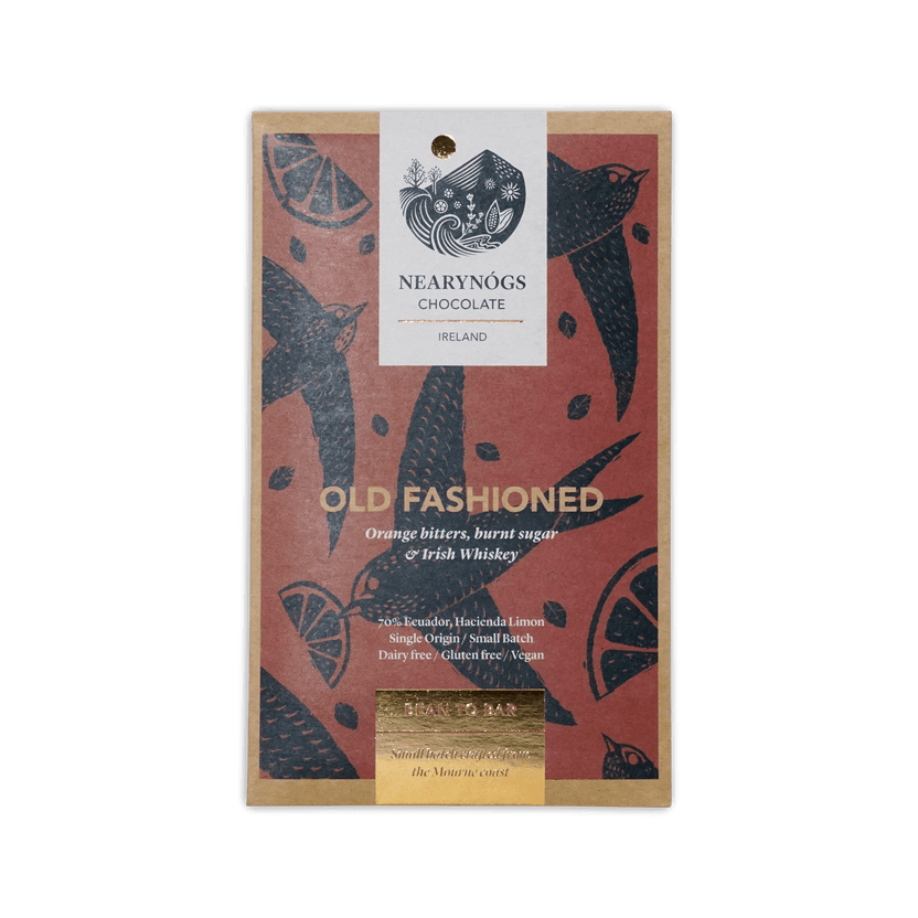 A rectangular dark chocolate bar wrapper with red background black bird and citrus designs from nearynogs ireland