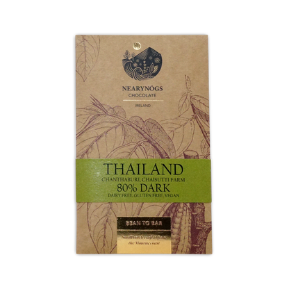 A brown kraft paper wrapper with botanical illustrations and a green band for nearynogs dark thailand 80 percent chocolate