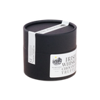 Black cylindrical container with white label and ribbon featuring nearynogs irish whiskey chocolate truffle dark truffles