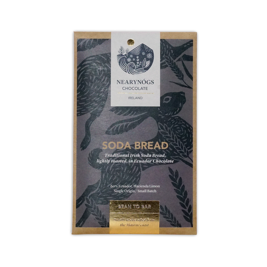 A rectangular package of nearynogs irish soda bread 60% chocolate with a dark gray wrapper featuring black birds and gold foil text