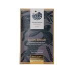 A rectangular package of nearynogs irish soda bread 60% chocolate with a dark gray wrapper featuring black birds and gold foil text