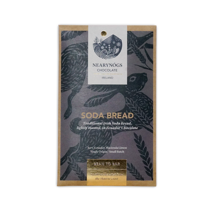A rectangular package of nearynogs irish soda bread 60% chocolate with a dark gray wrapper featuring black birds and gold foil text