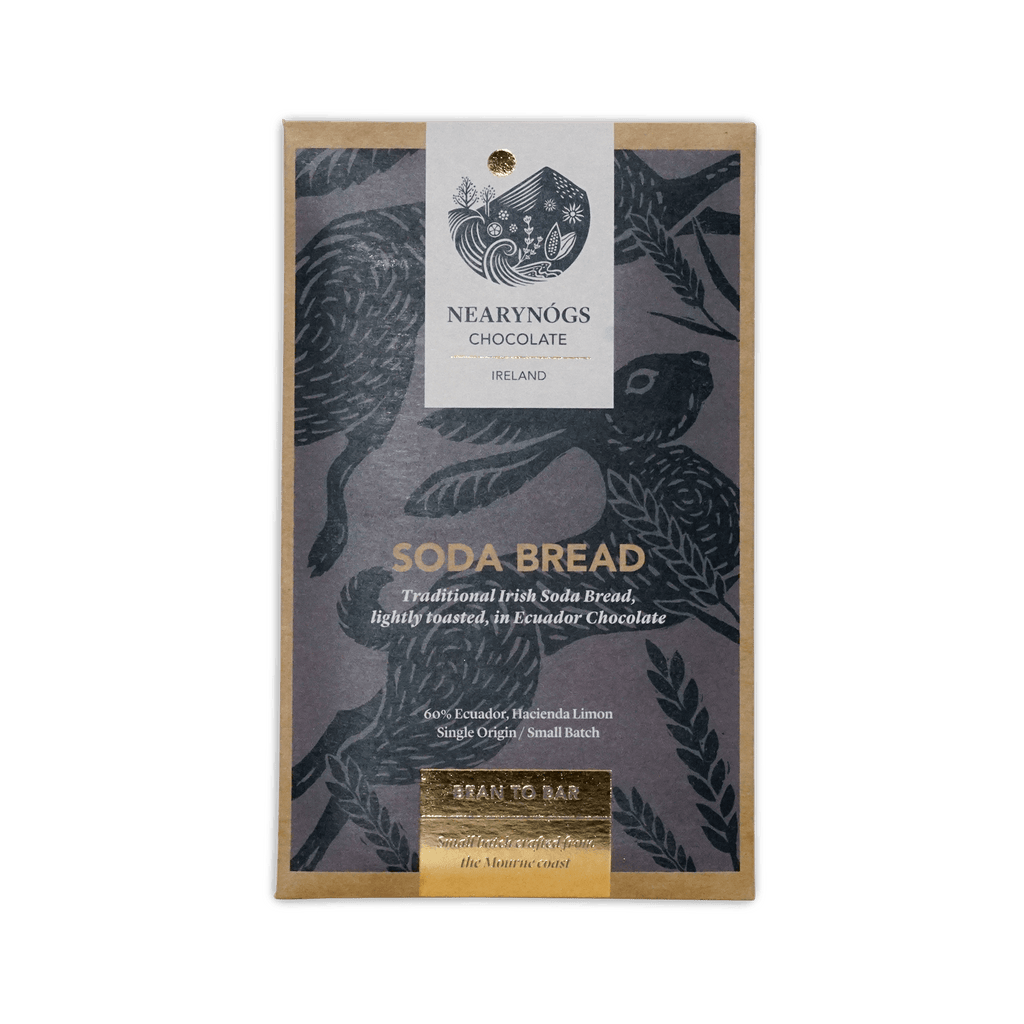 A rectangular package of nearynogs irish soda bread 60% chocolate with a dark gray wrapper featuring black birds and gold foil text