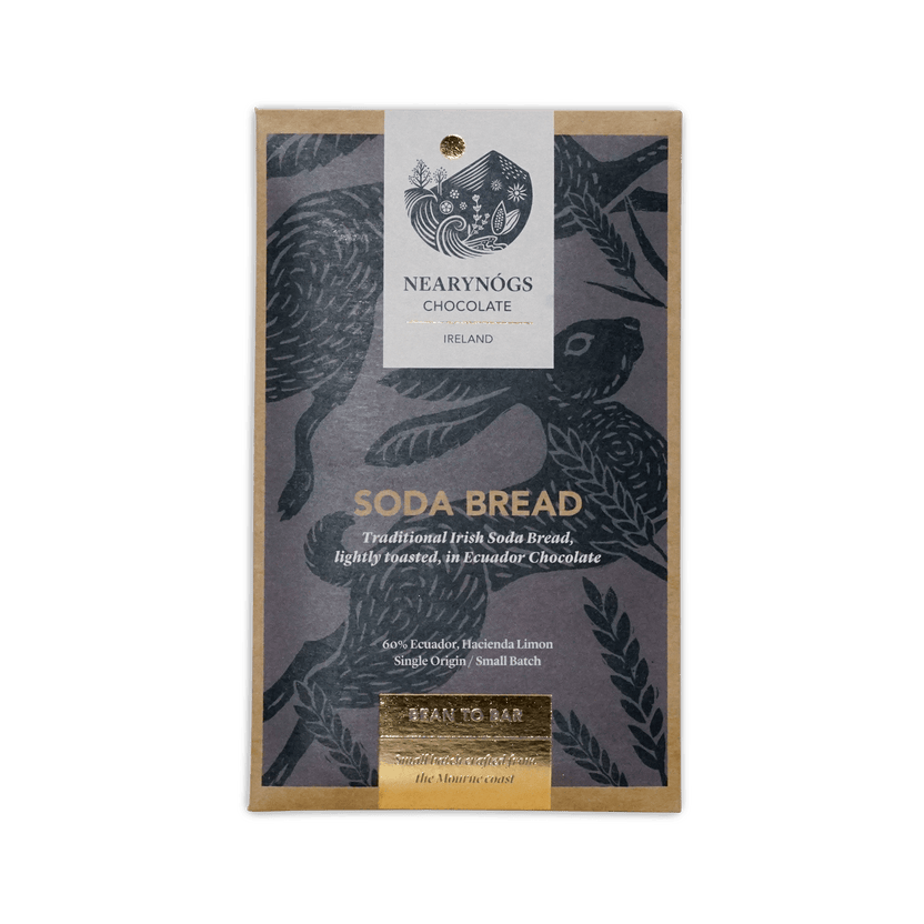 A rectangular package of nearynogs irish soda bread 60% chocolate with a dark gray wrapper featuring black birds and gold foil text