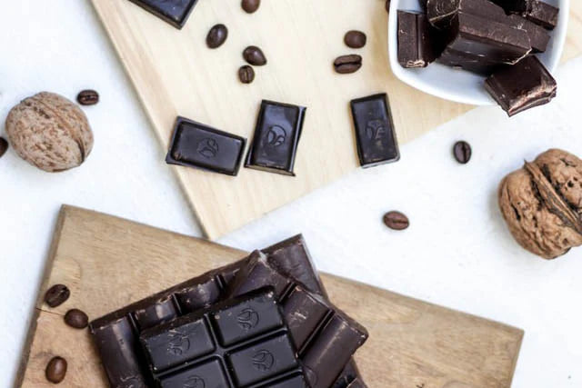 Dark chocolate bar with a glossy finish and embossed logo on each square.