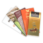 Golden Al Nassma camel milk chocolate bar wrapper with camel silhouette and hazelnuts in Nutty Chocolate Bar Bundle
