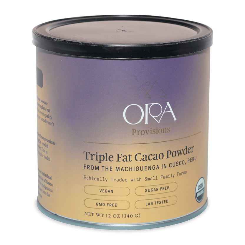 Ora triple fat cacao powder in cylindrical container with purple beige label