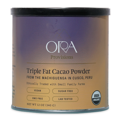 Ora triple fat cacao powder in sleek metallic tin with purple-to-gold label