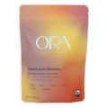 Ora Tantric Rose Blossom Cacao pouch in vibrant peach-to-orange gradient