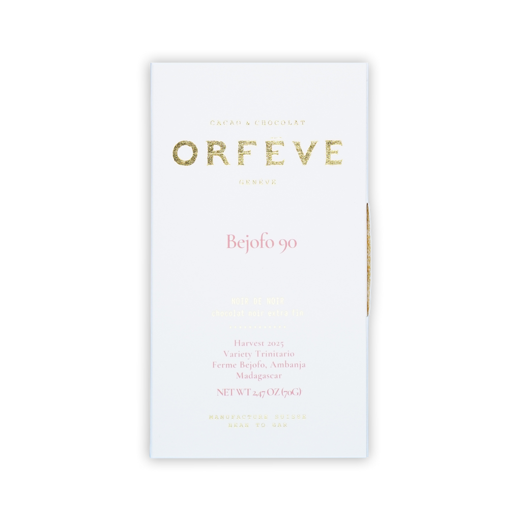 A white box of Orfeve Bejofo 90 chocolate on a black background, featuring gold foil and pink printed text.