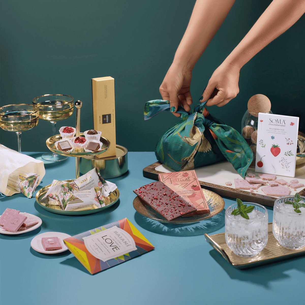 Pop, Clink, Cocoa celebration chocolates with sparkling wine and a furoshiki being tied