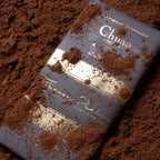 Pralus Chuao 75% dark blue gold foil bar dusted with cocoa powder