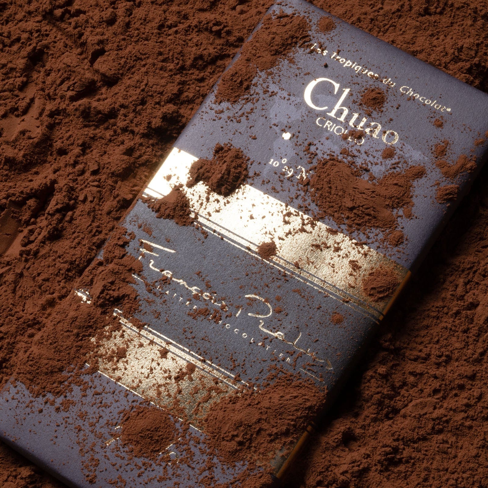 Pralus Chuao 75% dark blue gold foil bar dusted with cocoa powder
