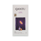 Qantu Chaska bar, white box with an illustration of a couple looking at a glowing cacao pod in a night sky, reading 70% Dark Chocolate, 50 g.