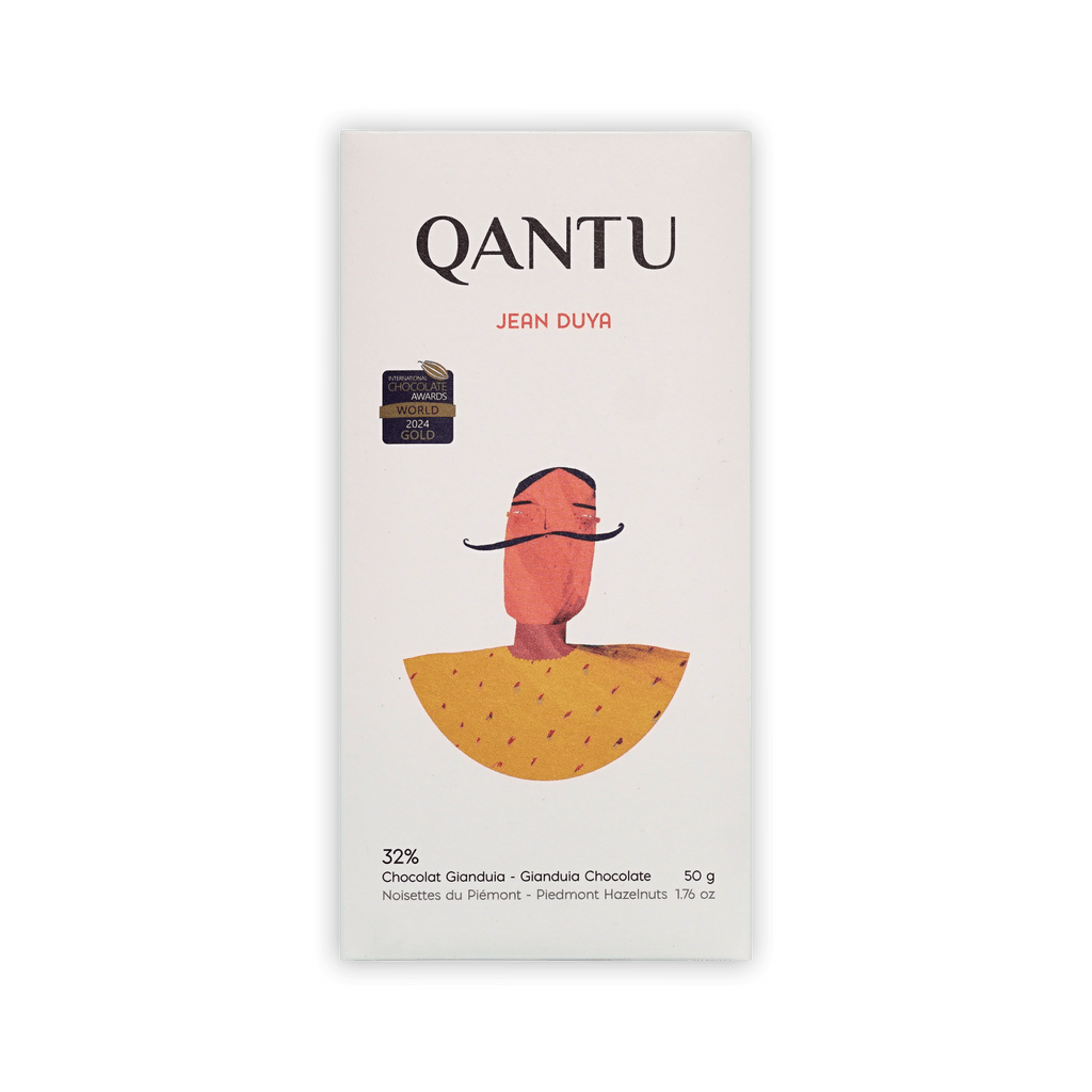 Qantu Jean Duya 32% Gianduia bar, cream box with an illustrated mustached figure in a yellow cape, 50g
