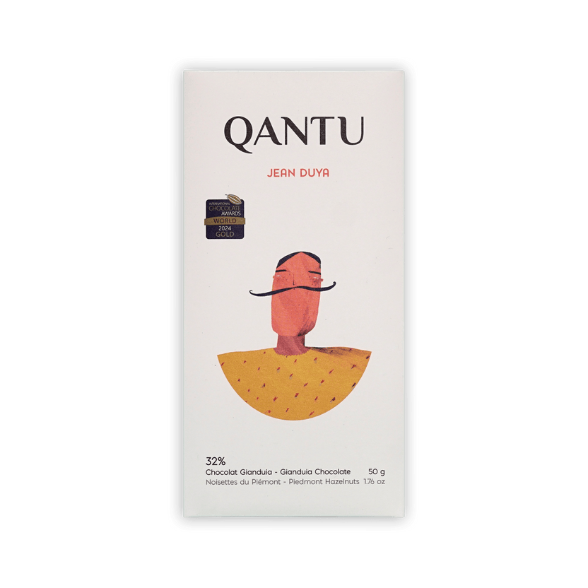 Qantu Jean Duya 32% Gianduia bar, cream box with an illustrated mustached figure in a yellow cape, 50g