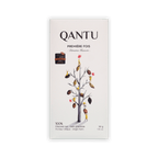 Qantu Premiere Fois 100% dark chocolate bar, cream box with an illustrated bare tree hung with cacao pods, 50g.