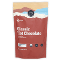 Raaka Classic Hot Chocolate in red resealable pouch with mountain graphics