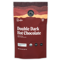 Raaka Double Dark Hot Chocolate maroon pouch with sunset design, organic cane sugar-free certifications