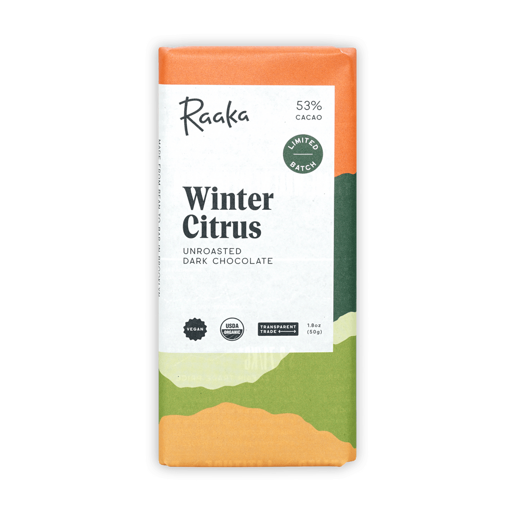 Raaka Winter Citrus bar in an orange and green landscape wrapper, unroasted dark chocolate, 53%.
