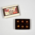 Ranger Oregon Bigleaf Maple Bonbons: 6 glossy dark chocolate with golden leaf swirls in box