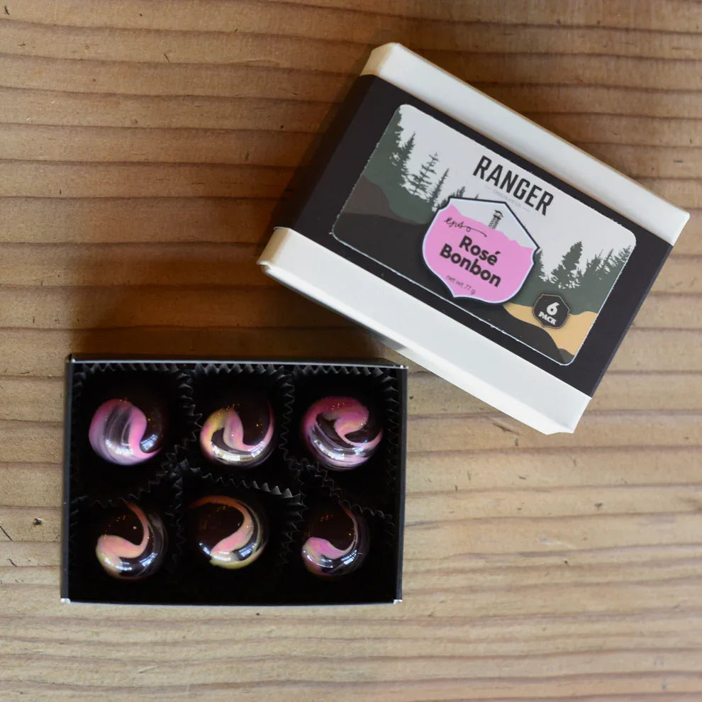 Black and white box of ranger rosé bonbons with pink and dark chocolate swirls contains six pcs of chocolates