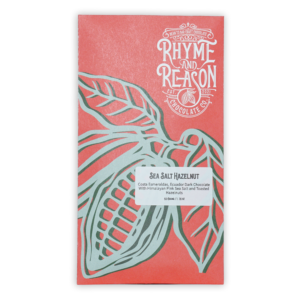 Rhyme and Reason Dark Chocolate w/ Salted Hazelnuts 72% coral wrapper