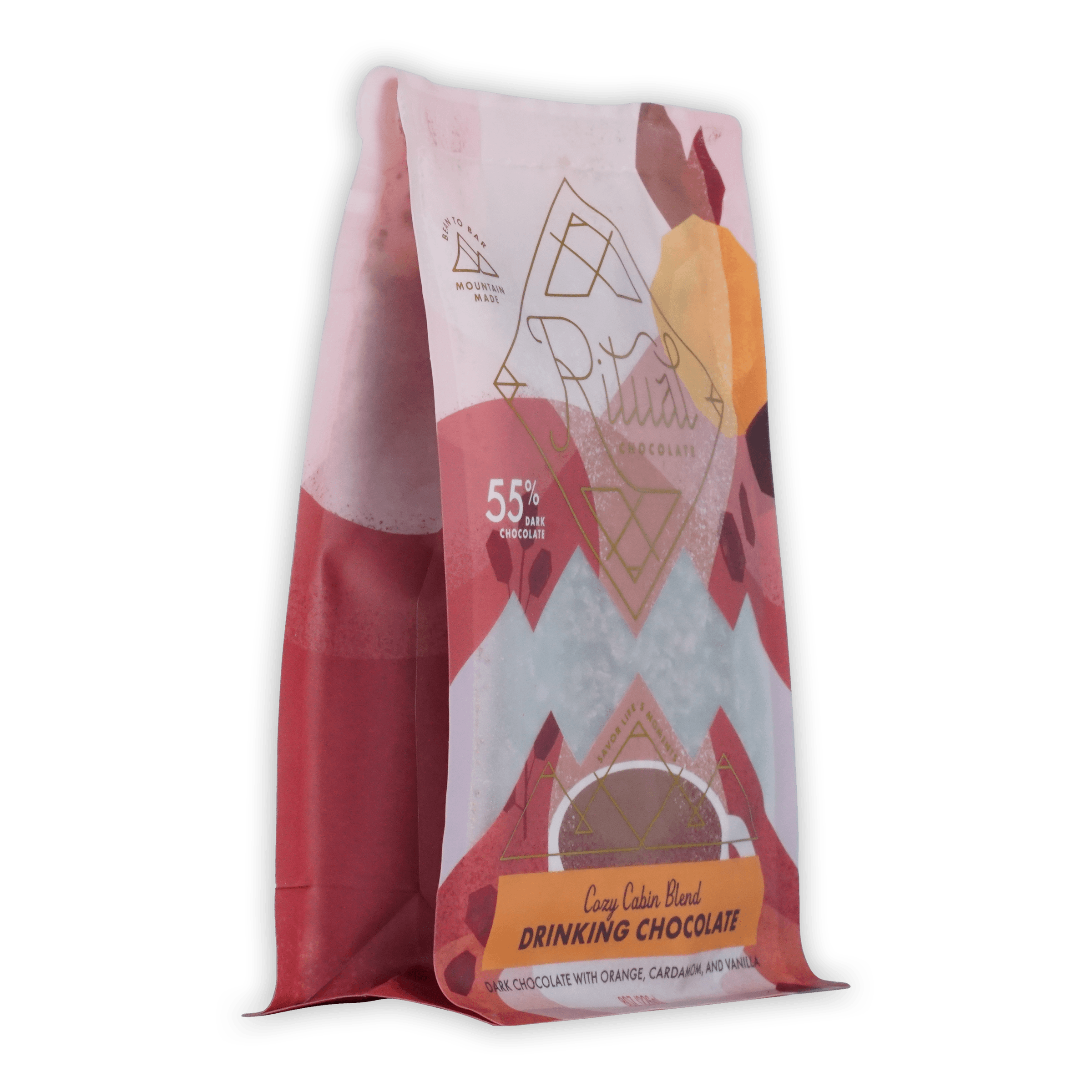 A vibrant pink and white bag of ariana’s cozy cabin blend ritual drinking chocolate 55 percent with geometric orange accents