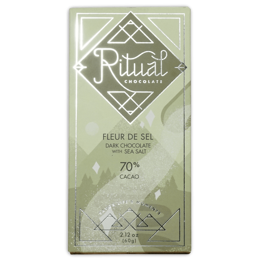 Ritual Chocolate Fleur de Sel bar in a sage green box with silver diamond logo, reading Dark Chocolate with Sea Salt, 70% Cacao.
