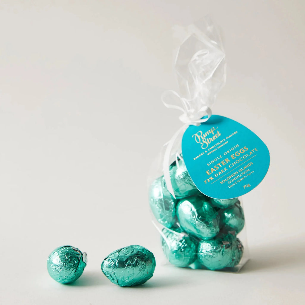 A bag of teal foil wrapped dark chocolate easter eggs with a blue rump street label from pump street solomon islands 72%