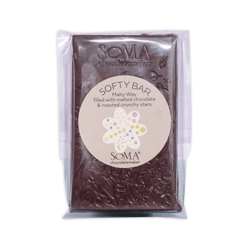 Soma Softy Bar Malty Way chocolate in clear packaging with floral-embossed bar and round label