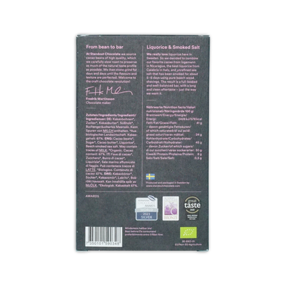 Dark gray standout chocolate bar packaging with white text and swedish flag featuring liquorice and smoked salt flavor