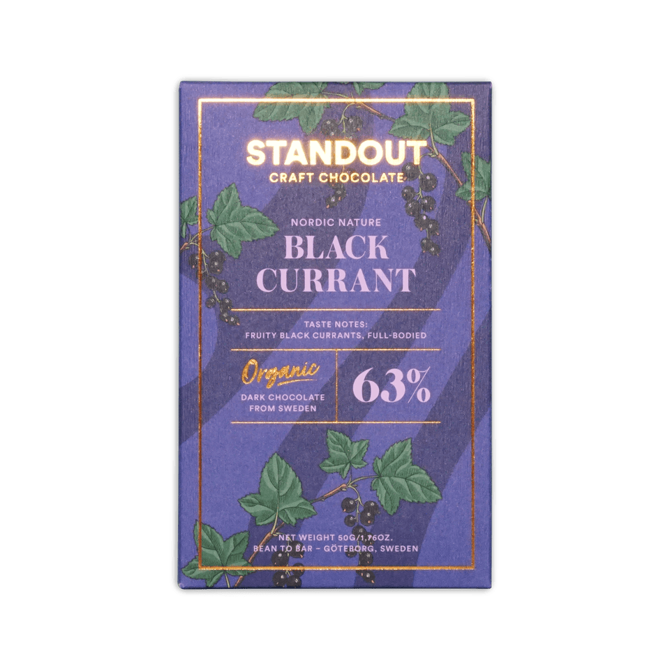 Standout Craft Chocolate bar, purple box with black currant illustration, marked Nordic Nature Black Currant 63%.