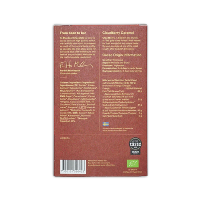 Back side of a brown rectangular standout chocolate nordic nature cloudberry caramel 49 percent box with swedish flag and organic logo