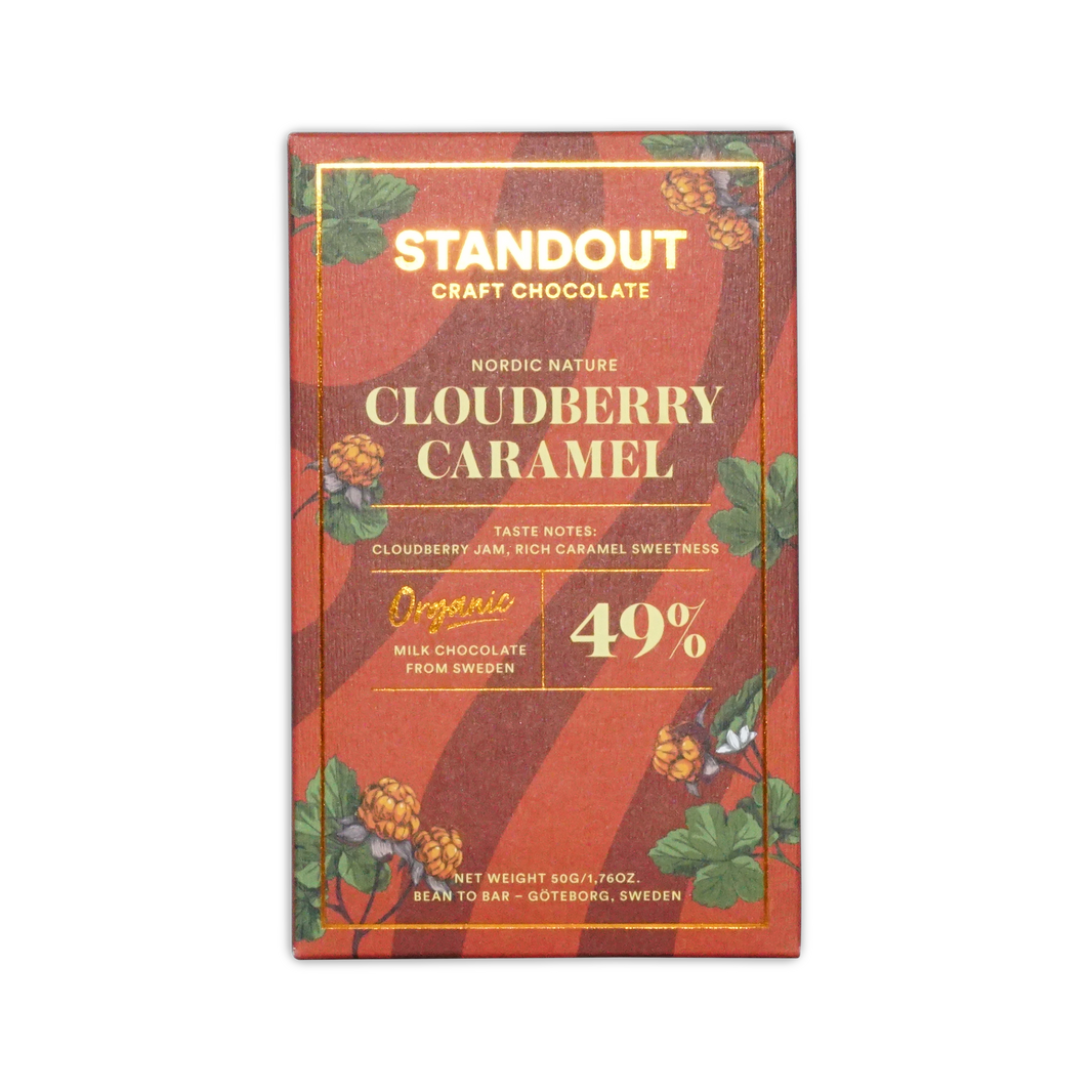 A red and gold packaged standout craft chocolate bar with nordic nature cloudberry caramel organic milk chocolate from Sweden