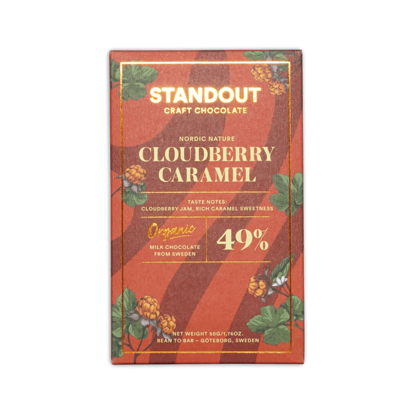 A red and gold packaged standout craft chocolate bar with nordic nature cloudberry caramel organic milk chocolate from Sweden