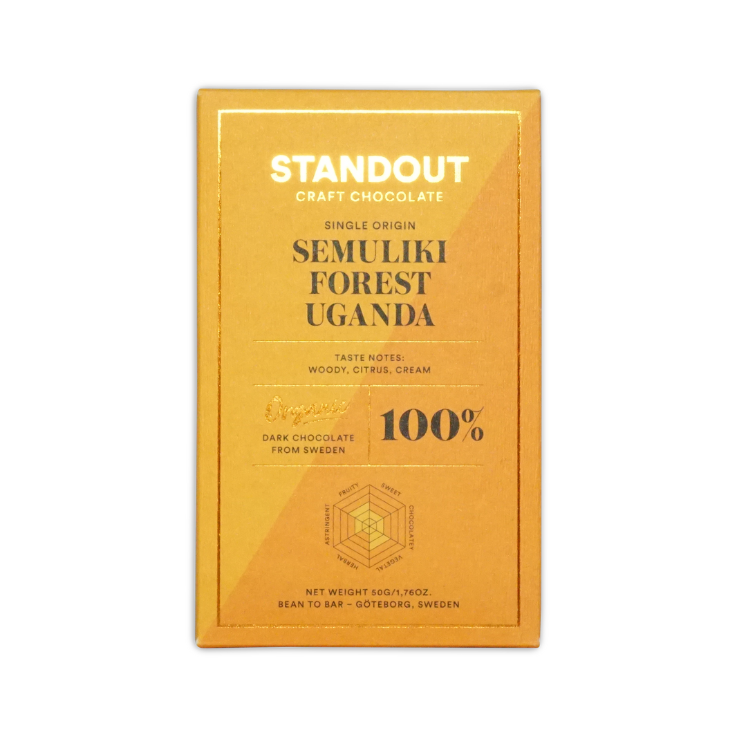A golden yellow wrapper for standout craft chocolates 100 percent dark chocolate from ugandas semuliki forest with woody citrus cream notes
