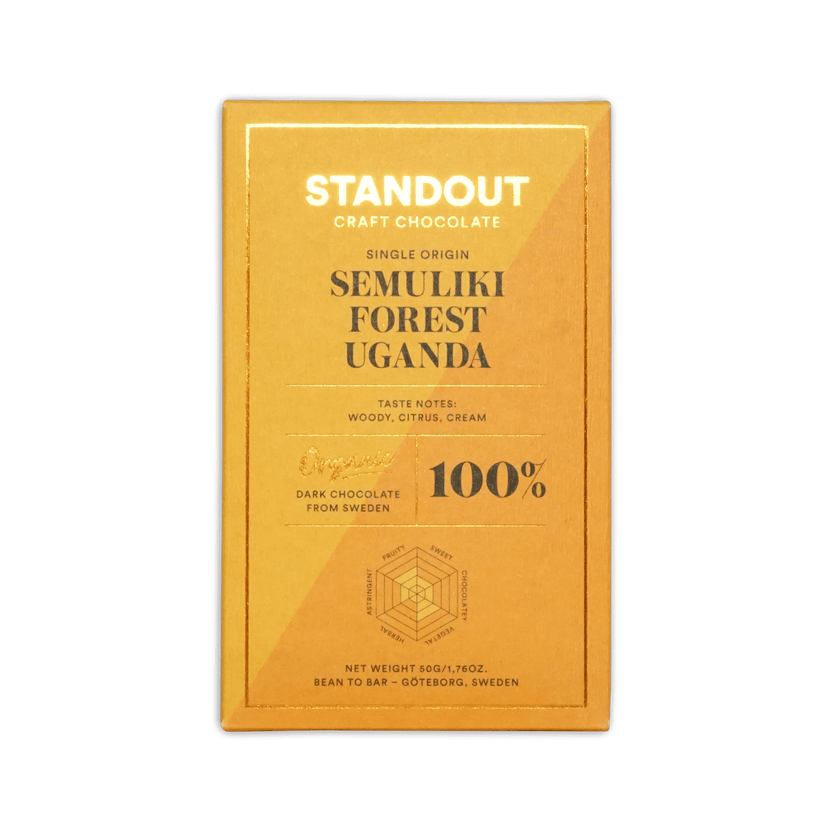 A golden yellow wrapper for standout craft chocolates 100 percent dark chocolate from ugandas semuliki forest with woody citrus cream notes