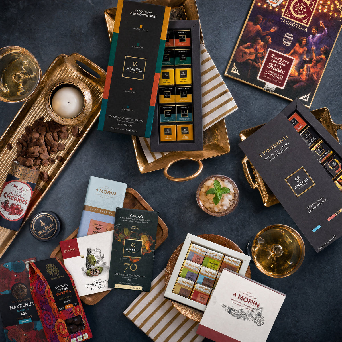Sweet Amends Very Sorry dark chocolate gift bundle, boxes and bars on gold trays.