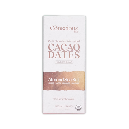 A white rectangular package of the Conscious Bar dark almond sea salt 72 percent cacao and dates chocolate bar