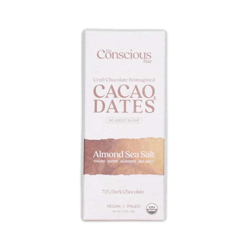 A white rectangular package of the Conscious Bar dark almond sea salt 72 percent cacao and dates chocolate bar