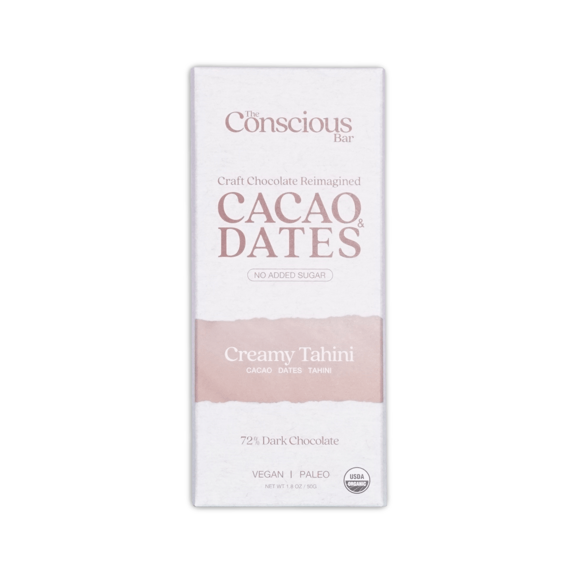 A white rectangular package of the conscious bar dark creamy tahini 72 percent cacao and dates chocolate bar with pink stripe