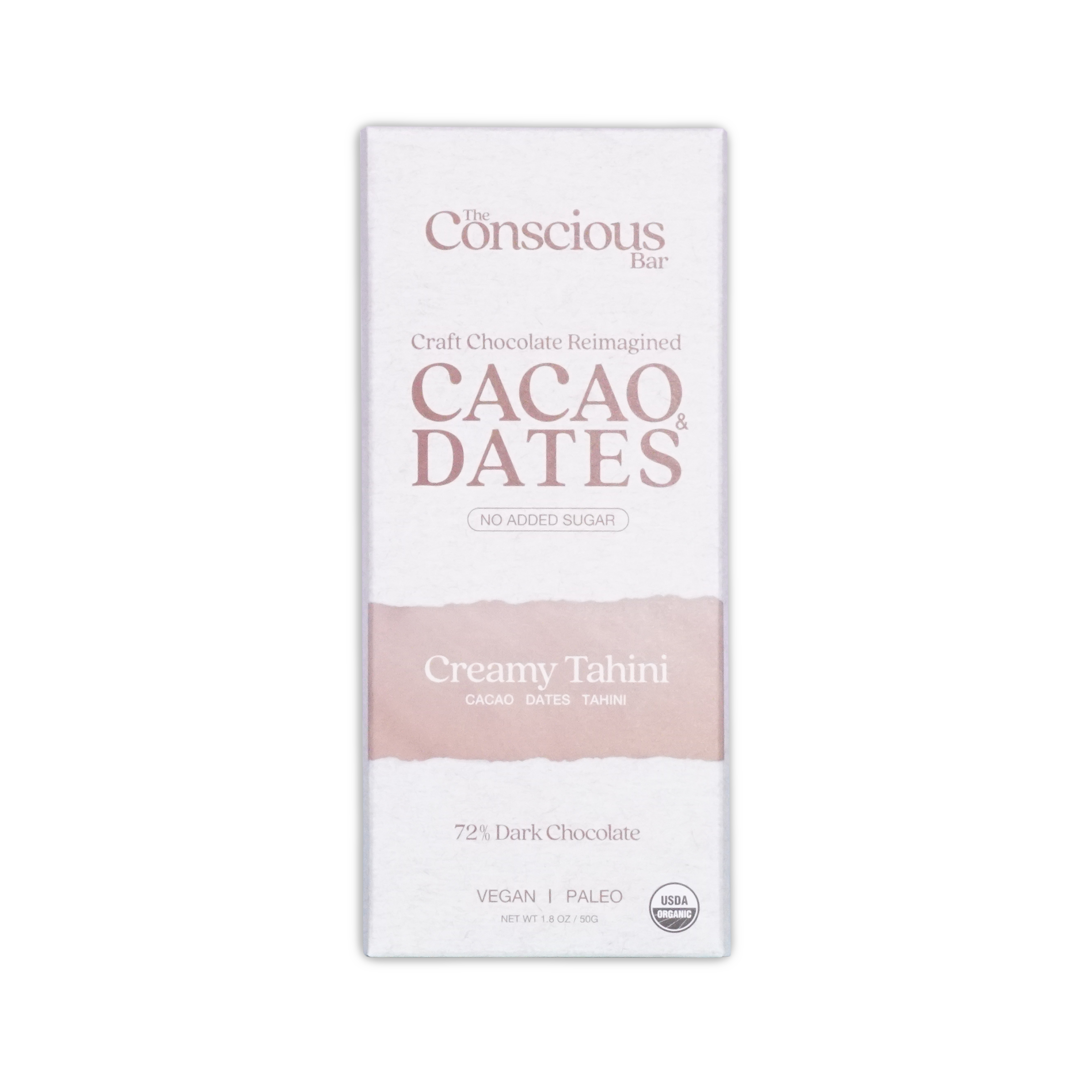 A white rectangular package of the conscious bar dark creamy tahini 72 percent cacao and dates chocolate bar with pink stripe