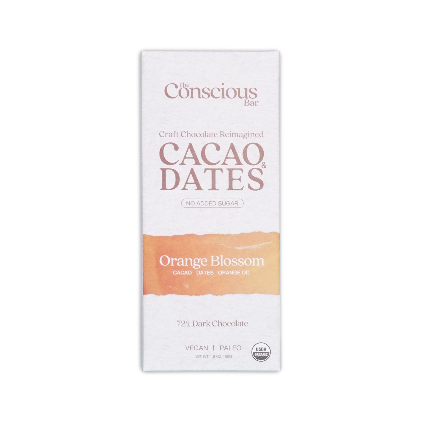 The conscious bar dark orange blossom 72 percent cacao and dates chocolate bar in white and peach minimalist wrapper